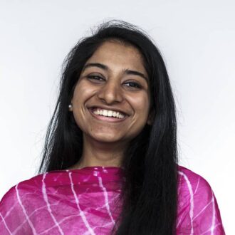 Smiling survivor wearing a bright pink shirt