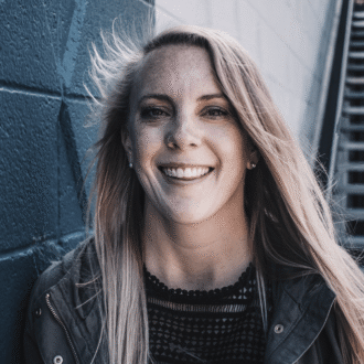 Smiling survivor wearing a denim jacket