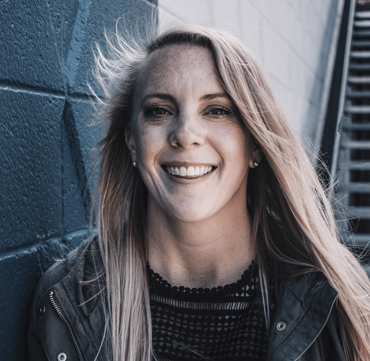 Smiling survivor wearing a denim jacket