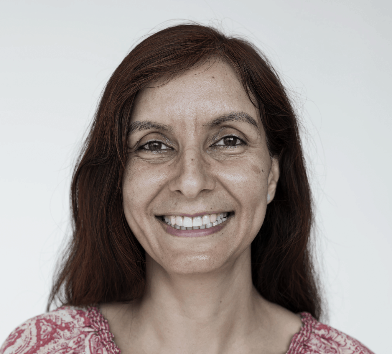 Smiling survivor with auburn hair