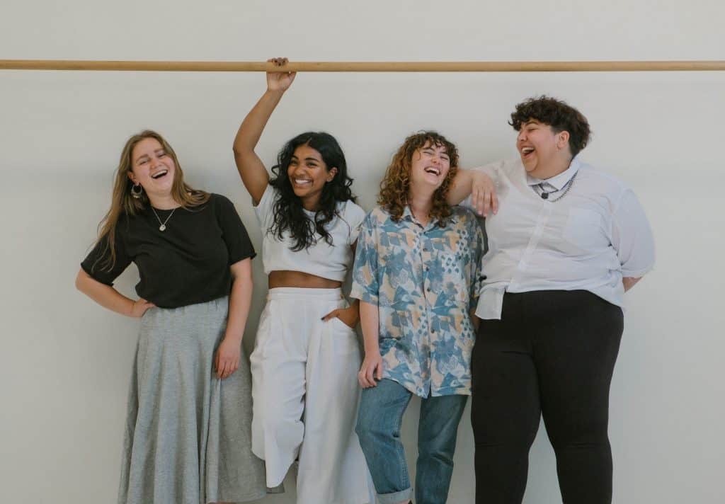 Four diverse survivors sharing a laugh